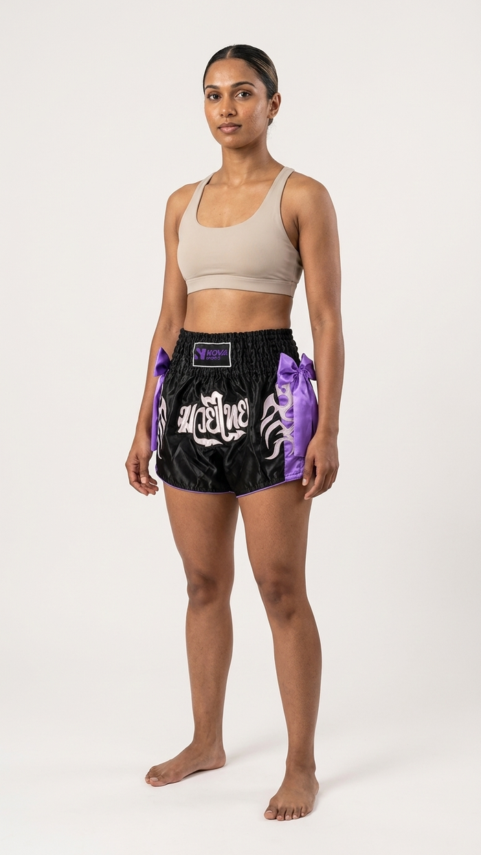 Black satin Muay Thai shorts with purple side panels and high slits — Nova Sports Mauritius — Shorts available in Mauritius
