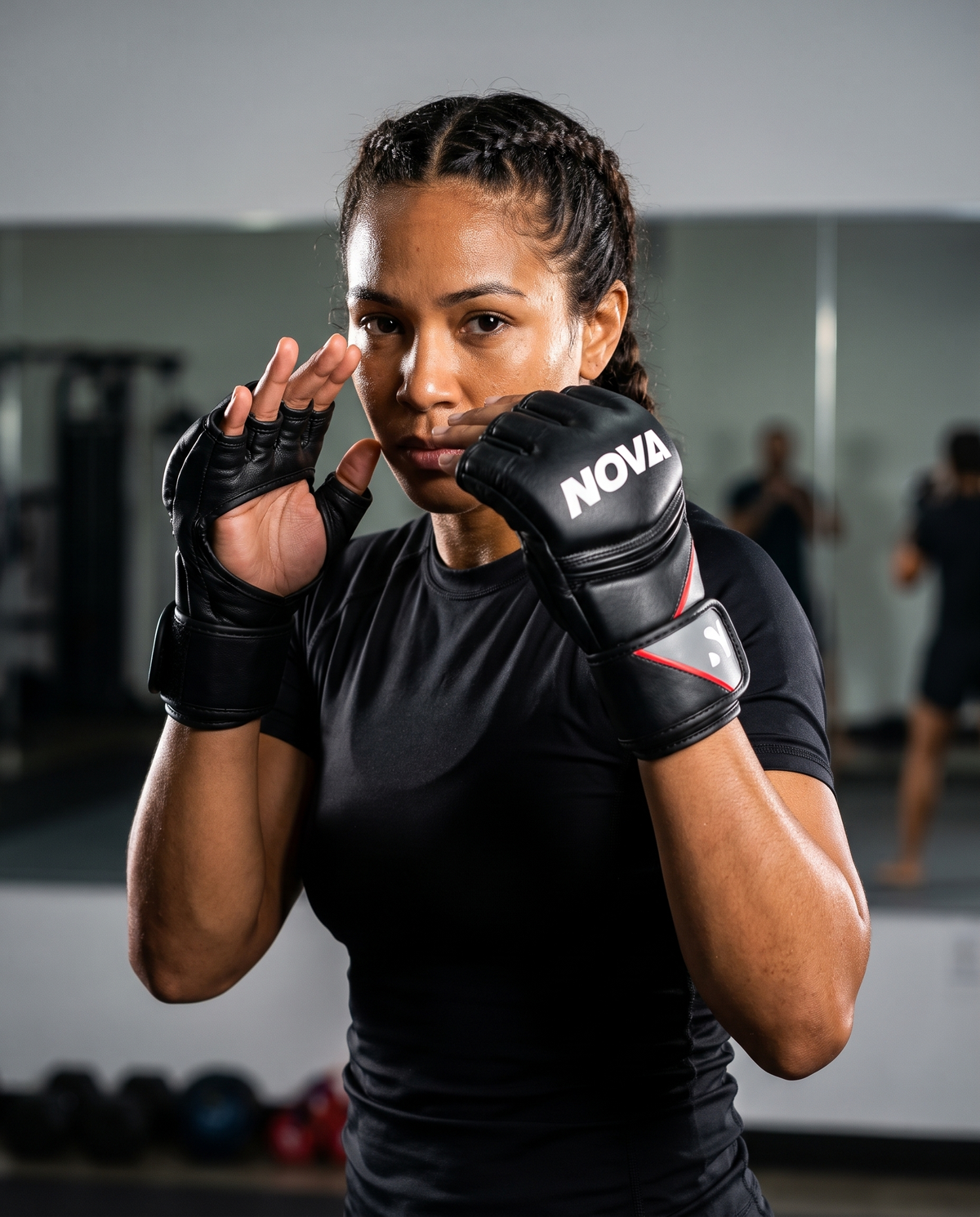 Model in open-palm guard wearing NOVA black, grey and red MMA grappling gloves — Gloves from Nova Sports Mauritius
