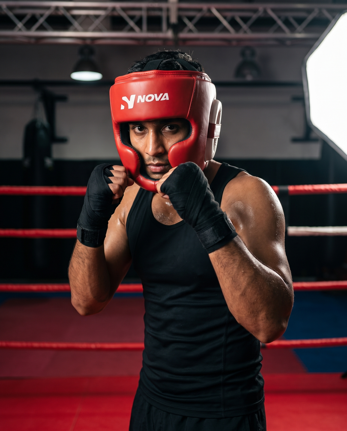 Fighter in ready stance in the ring wearing NOVA full red leather head guard — Head Guards from Nova Sports Mauritius
