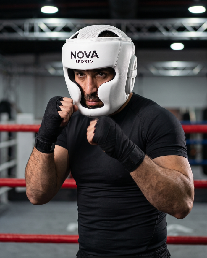 Coach in ready stance in the ring wearing NOVA white boxing head guard — Head Guards available in Mauritius
