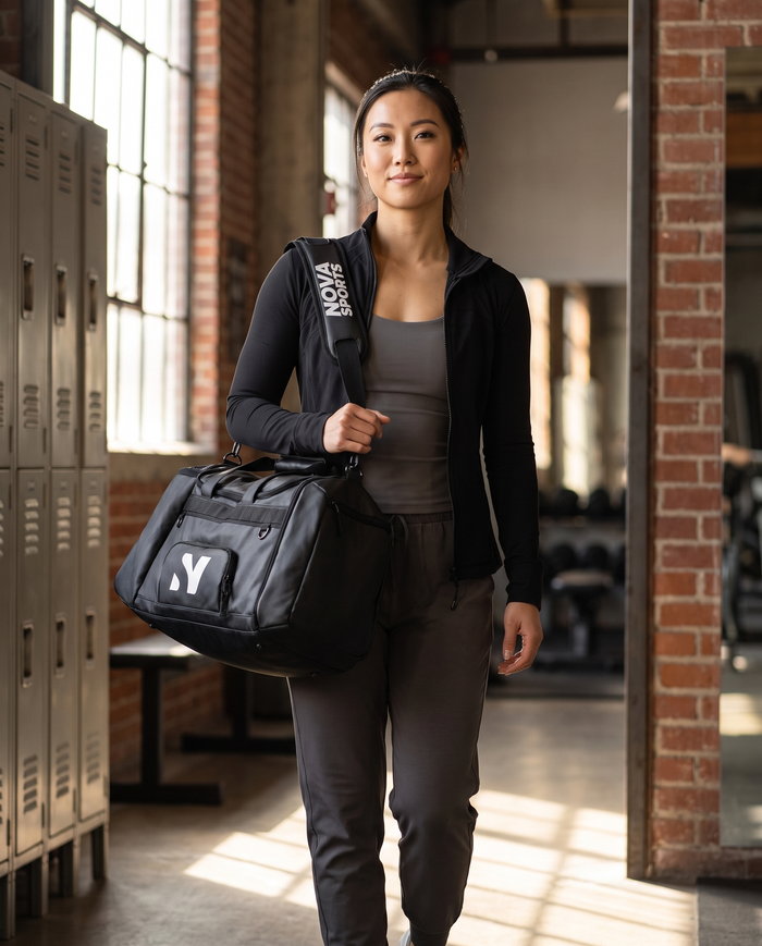 Black gym holdall with top zip, end pockets and a padded shoulder strap — Nova Sports Mauritius — Bags available in Mauritius
