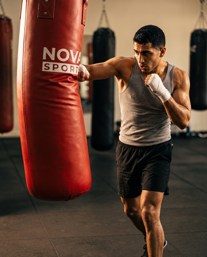 Filled heavy punching bag hanging on its chain set — punching bags at Nova Sports Mauritius — Bags & Speed Balls available in Mauritius
