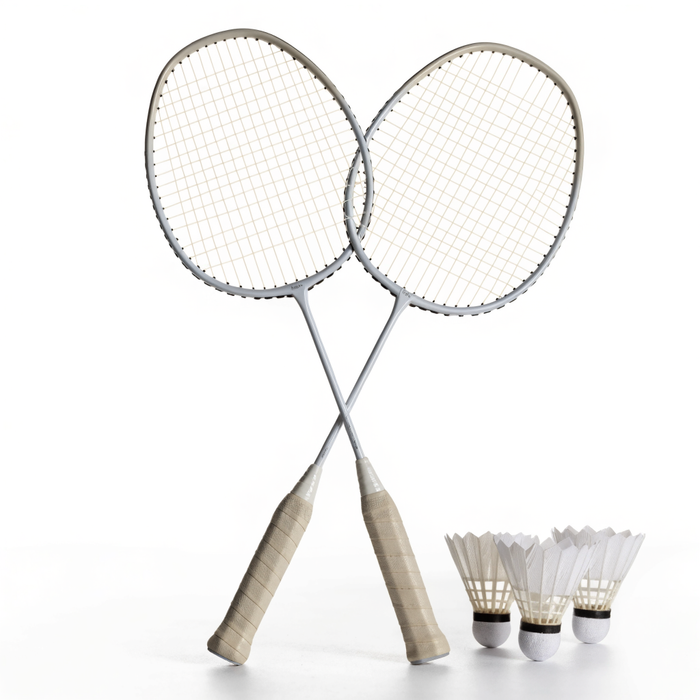 Two badminton rackets crossed with three white feather shuttlecocks — badminton sets at Nova Sports Mauritius — Games available in Mauritius
