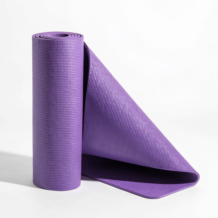 Rolled purple yoga mat beside a partly unrolled one — yoga mats at Nova Sports Mauritius — Gym available in Mauritius
