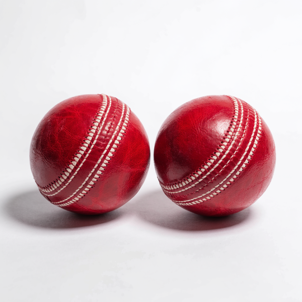 Two red leather cricket balls with white stitched seams — cricket hard balls at Nova Sports Mauritius — Cricket from Nova Sports Mauritius
