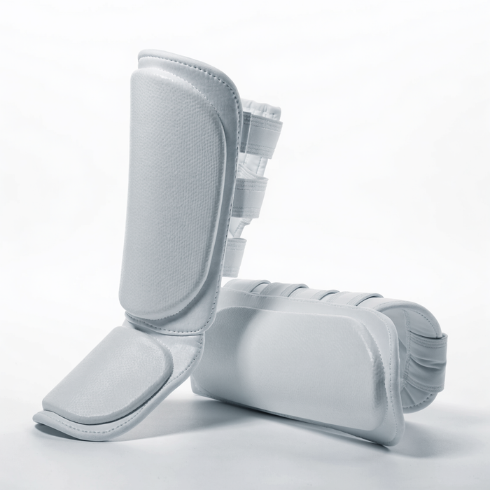 Nova Sports taekwondo shin guards in white dipped foam, pair shown on a white background — Shin & Foot Guards available in Mauritius
