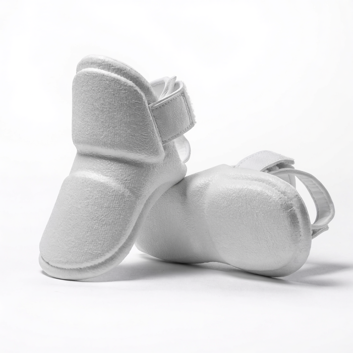 Nova Sports taekwondo foot protectors in white dipped foam, pair shown on a white background — Shin & Foot Guards available in Mauritius
