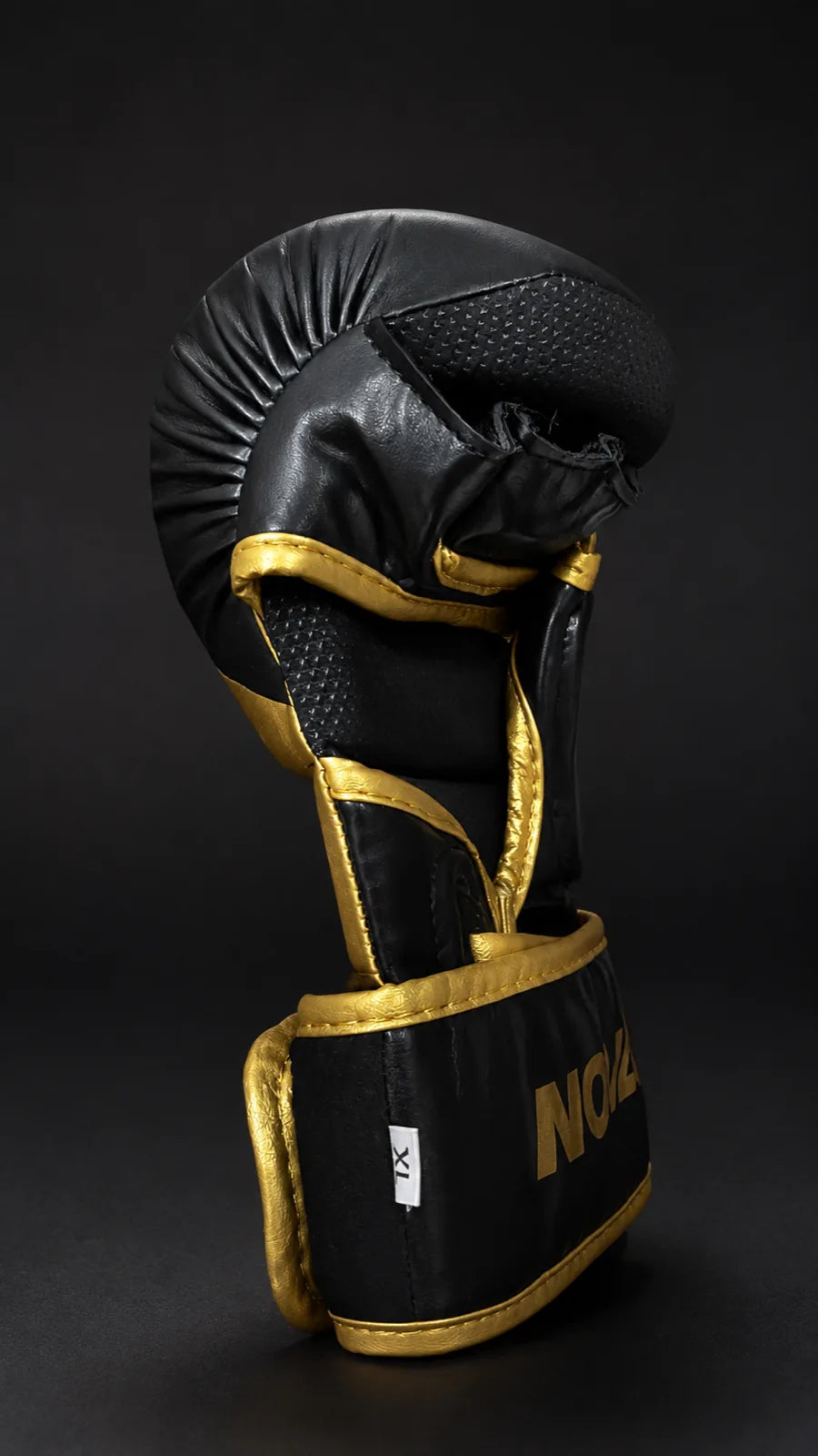 Nova MMA sparring glove in black and gold, knuckle detail — Gloves from Nova Sports Mauritius
