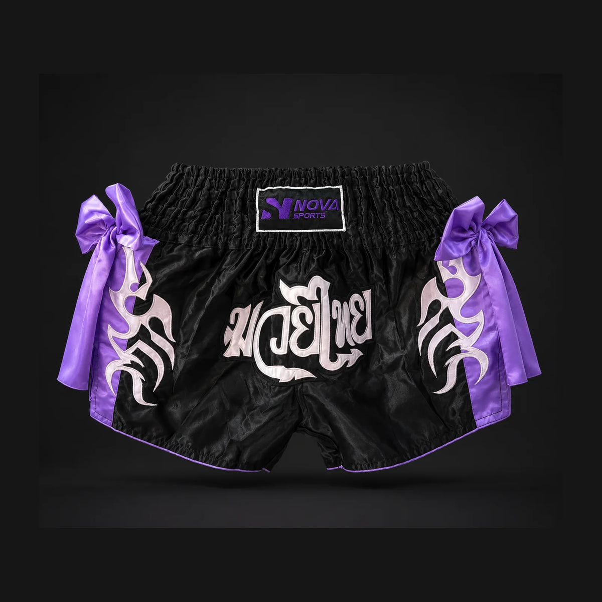 Nova black and purple Muay Thai shorts with tribal print and ribbon bows — Shorts from Nova Sports Mauritius
